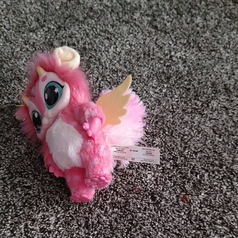 Pink and White Stuffed Animal with Wings